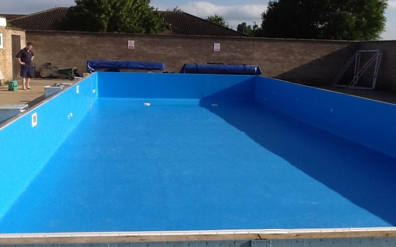 Swimming pool interior with a newly finished blue lining